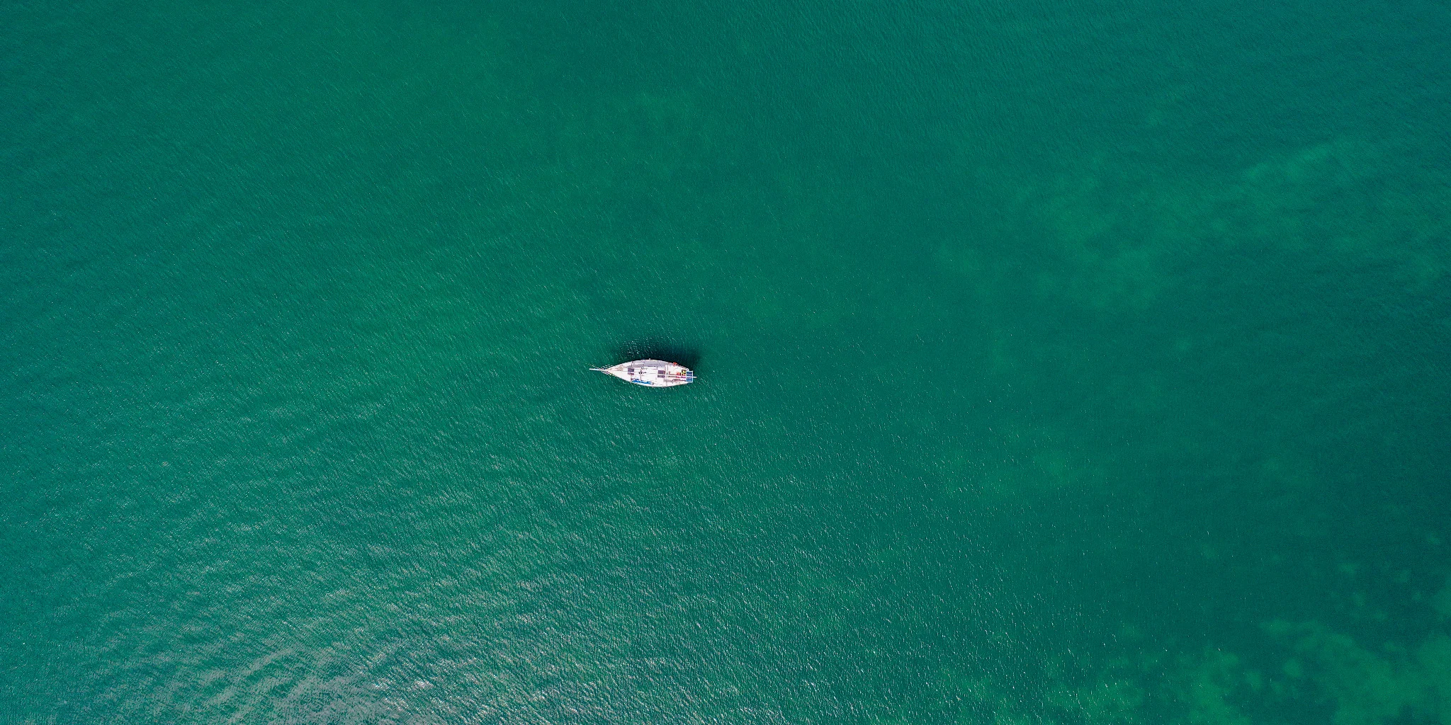 A lone boat seen from directly above